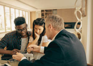 Couple discussing a joint mortgage before buying their first home together